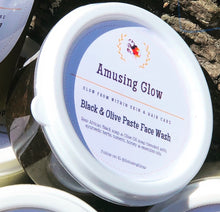 Load image into Gallery viewer, Just put a small dollop on Black & Olive soap paste onto your finger, place it in the palm of your hand and add water to work into a rich foam lather. Massage over wet face for two minutes, rinse with warm water and towel blot your face. Follow up with your favorite Amusing Glow whipped moisturizing face butter.